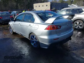 2008 Mitsubishi Lancer Evolution GSR with VIN JA3AW86V78U048263, listed as a IAAI auction lot 41670970 with 146,293 mi miles. Bid and sale history available at carsss.com. Image 3.