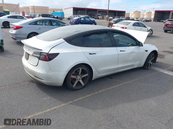 2019 Tesla Model 3 Mid Range with VIN 5YJ3E1EA6KF396946, listed as a IAAI auction lot 41123058 with 69,013 mi miles and . Bid and sale history available at carsss.com. Image 4.