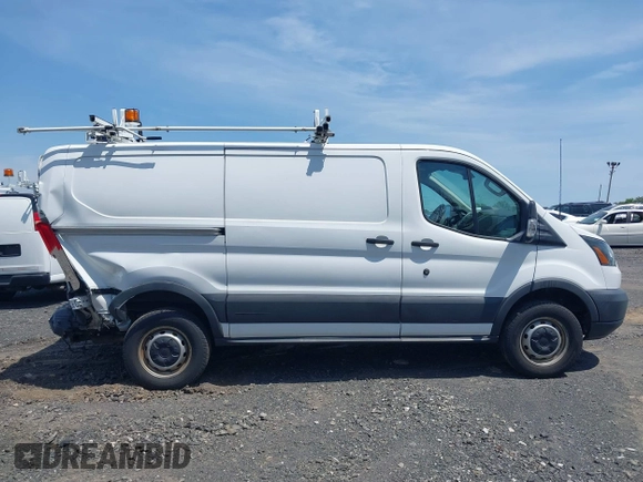 2016 Ford Transit Cargo z VIN 1FTYR1YM0GKB55605, wystawiony jako IAAI lot #42211489 z przebiegiem Nie podano mil oraz . Historia ofert i sprzedaży dostępna na DreamBid. Obrazek 13.