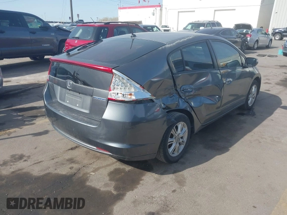 2010 Honda Insight EX with VIN JHMZE2H71AS032532, listed as a IAAI auction lot 41988221 with 333,144 mi miles and . Bid and sale history available at DreamBid. Image 4.