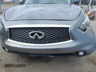 2014 Infiniti QX70 with VIN JN8CS1MU8EM450428, listed as a IAAI auction lot 42233727 with 88,342 mi miles and . Bid and sale history available at DreamBid. Image 19.