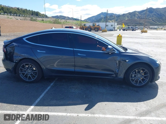 2019 Tesla Model 3 Mid Range with VIN 5YJ3E1EA6KF307456, listed as a IAAI auction lot 41944454 with 99,059 mi miles and . Bid and sale history available at DreamBid. Image 12.