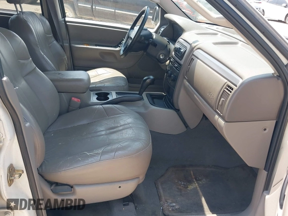 2004 Jeep Grand Cherokee Laredo with VIN 1J4GX48S94C222249, listed as a IAAI auction lot 42598242 with 196,745 mi miles and . Bid and sale history available at DreamBid. Image 5.