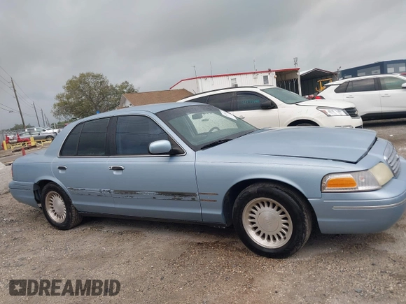 1999 Ford Crown Victoria z VIN 2FAFP73WXXX221069, wystawiony jako IAAI lot #41750127 z przebiegiem 177 142 mil mil oraz . Historia ofert i sprzedaży dostępna na DreamBid. Obrazek 13.