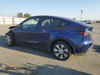2023 Tesla Model Y Long Range with VIN 7SAYGDEE7PA146322, listed as a Copart auction lot 54071165 with 38,334 mi miles and Salvage Title. Bid and sale history available at DreamBid. Image 2.