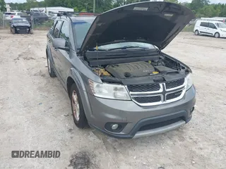 2012 Dodge Journey SXT z VIN 3C4PDCBGXCT184126, wystawiony jako IAAI lot #42473494 z przebiegiem 168 314 mil mil oraz . Historia ofert i sprzedaży dostępna na DreamBid. Obrazek 1.