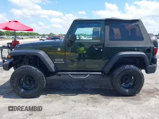 2010 Jeep Wrangler Sport with VIN 1J4AA2D17AL126737, listed as a IAAI auction lot 42237596 with 119,391 mi miles and . Bid and sale history available at carsss.com. Image 14.