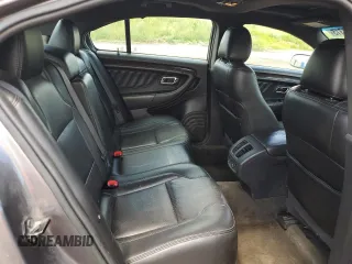 2013 Ford Taurus Limited z VIN 1FAHP2F81DG229944, wystawiony jako Copart lot #63218315 z przebiegiem 199 897 mil mil oraz Czysty tytuł • Clean title. Historia ofert i sprzedaży dostępna na DreamBid. Obrazek 10.