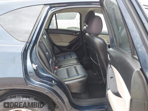 2015 Mazda CX-5 Touring with VIN JM3KE2CY5F0449195, listed as a IAAI auction lot 41894567 with 124,694 mi miles and . Bid and sale history available at DreamBid. Image 8.