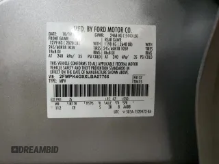 2020 Ford Edge SE z VIN 2FMPK4G9XLBA07766, wystawiony jako Copart lot #56852365 z przebiegiem 151 664 mil mil oraz Szkoda całkowita • Salvage title. Historia ofert i sprzedaży dostępna na DreamBid. Obrazek 14.