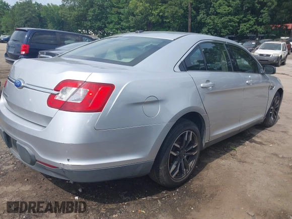 2011 Ford Taurus SE with VIN 1FAHP2DW9BG179423, listed as a IAAI auction lot 39683731 with 297,445 mi miles. Bid and sale history available at carsss.com. Image 4.