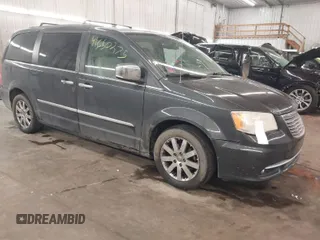 2011 Chrysler Town & Country Touring-L with VIN 2A4RR8DG5BR799358, listed as a IAAI auction lot 41650275 with 143,779 mi miles. Bid and sale history available at carsss.com. Image 1.