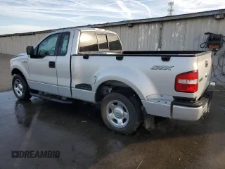 2006 Ford F-150 STX with VIN 1FTRF02W46KA92833, listed as a Copart auction lot 76401174 with 132,603 mi miles and Salvage Title. Bid and sale history available at carsss.com. Image 2.