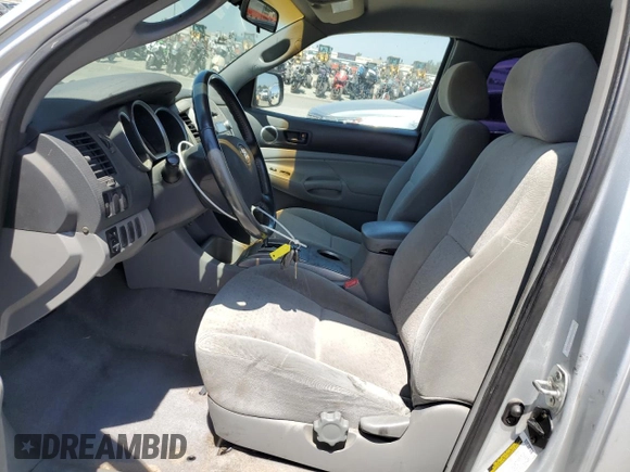 2005 Toyota Tacoma PreRunner with VIN 5TETU62N05Z047131, listed as a Copart auction lot 61256985 with 165,573 mi miles and Salvage title. Bid and sale history available at DreamBid. Image 7.