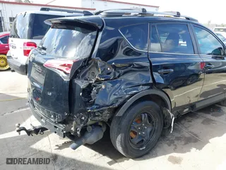 2018 Toyota RAV4 LE with VIN 2T3ZFREV9JW457062, listed as a IAAI auction lot 41696609 with 96,716 mi miles. Bid and sale history available at carsss.com. Image 6.