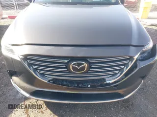 2016 Mazda CX-9 Grand Touring z VIN JM3TCBDY3G0104001, wystawiony jako IAAI lot #41961054 z przebiegiem 77 057 mil mil oraz . Historia ofert i sprzedaży dostępna na DreamBid. Obrazek 6.