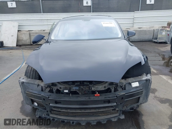2014 Tesla Model S 60 with VIN 5YJSA1H10EFP30234, listed as a IAAI auction lot 42182249 with 186,654 mi miles and . Bid and sale history available at DreamBid. Image 12.