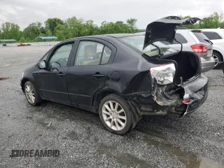 2011 Suzuki SX4 LE z VIN JS2YC5A28B6300625, wystawiony jako Copart lot #54044155 z przebiegiem 179 269 mil mil oraz Szkoda całkowita • Salvage title. Historia ofert i sprzedaży dostępna na DreamBid. Obrazek 2.
