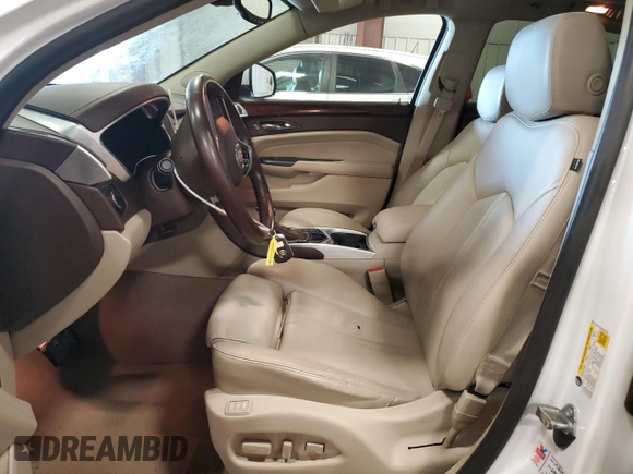 2015 Cadillac SRX Luxury Collection z VIN 3GYFNEE33FS641781, wystawiony jako Copart lot #50765905 z przebiegiem Nie podano mil oraz Szkody całkowita. Historia ofert i sprzedaży dostępna na DreamBid. Obrazek 7.