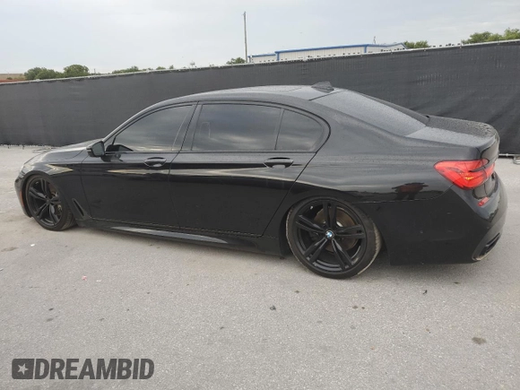 2016 BMW 7 Series 750i with VIN WBA7F0C56GGL99533, listed as a Copart auction lot 59091045 with 124,624 mi miles and Clean title. Bid and sale history available at DreamBid. Image 2.