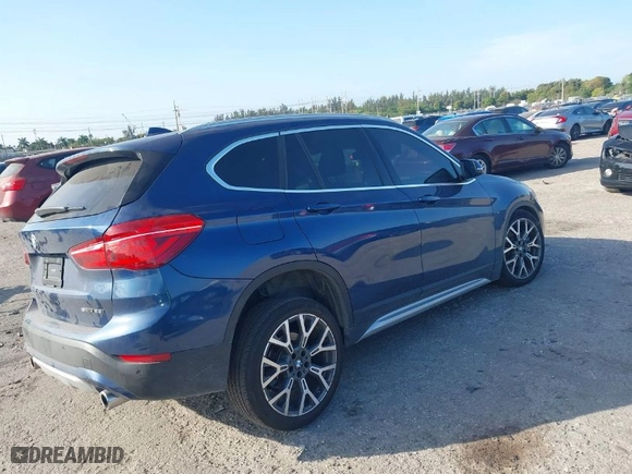 2021 BMW X1 sDrive28i with VIN WBXJG7C00M5S20495, listed as a IAAI auction lot 41608492 with 32,412 mi miles. Bid and sale history available at carsss.com. Image 4.