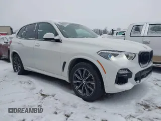 2020 BMW X5 M50i with VIN 5UXJU4C09LLE45658, listed as a IAAI auction lot 41307154 with 69,936 mi miles. Bid and sale history available at carsss.com. Image 1.