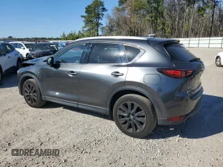 2021 Mazda CX-5 Signature with VIN JM3KFBEY2M0437304, listed as a Copart auction lot 88841415 with 57,100 mi miles and Salvage Title. Bid and sale history available at carsss.com. Image 2.