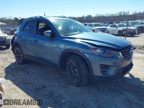 2016 Mazda CX-5 Grand Touring with VIN JM3KE2DY2G0715272, listed as a IAAI auction lot 41590492 with 134,176 mi miles. Bid and sale history available at carsss.com. Image 1.