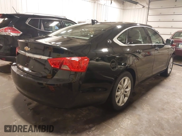 2018 Chevrolet Impala LT with VIN 1G1105S32JU122113, listed as a IAAI auction lot 42042957 with 152,895 mi miles and . Bid and sale history available at DreamBid. Image 4.