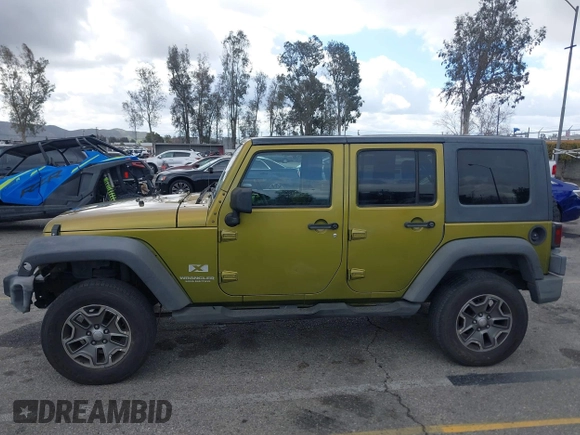 2007 Jeep Wrangler Unlimited X with VIN 1J8GB39107L114510, listed as a IAAI auction lot 41736367 with 467,567 mi miles and . Bid and sale history available at DreamBid. Image 14.