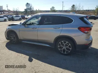 2021 BMW X1 sDrive28i with VIN WBXJG7C0XM5S33884, listed as a Copart auction lot 48413405 with 89,698 mi miles and Salvage Title. Bid and sale history available at DreamBid. Image 2.