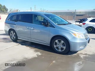 2011 Honda Odyssey Touring with VIN 5FNRL5H99BB020427, listed as a IAAI auction lot 41817314 with 103,280 mi miles and . Bid and sale history available at DreamBid. Image 1.