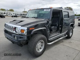 2005 Hummer H2 SUV with VIN 5GRGN23UX5H115383, listed as a Copart auction lot 71682984 with 157,405 mi miles and Salvage Title. Bid and sale history available at carsss.com. Image 1.
