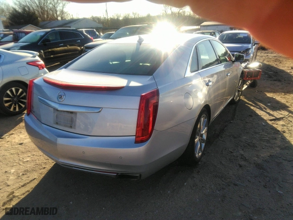 2014 Cadillac XTS Luxury with VIN 2G61M5S30E9187222, listed as a IAAI auction lot 41842676 with 113,594 mi miles. Bid and sale history available at carsss.com. Image 4.