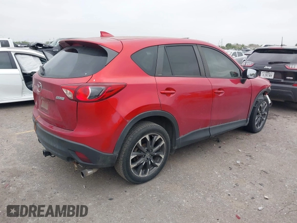 2016 Mazda CX-5 Grand Touring with VIN JM3KE2DY8G0871574, listed as a IAAI auction lot 41959686 with 95,416 mi miles and . Bid and sale history available at DreamBid. Image 4.