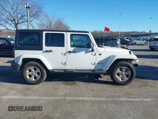 2013 Jeep Wrangler Unlimited Sahara with VIN 1C4BJWEG3DL658530, listed as a IAAI auction lot 41421006 with 115,321 mi miles and . Bid and sale history available at DreamBid. Image 14.