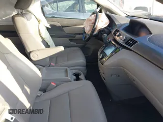 2014 Honda Odyssey Touring with VIN 5FNRL5H90EB077054, listed as a IAAI auction lot 41904456 with 197,869 mi miles and . Bid and sale history available at carsss.com. Image 5.