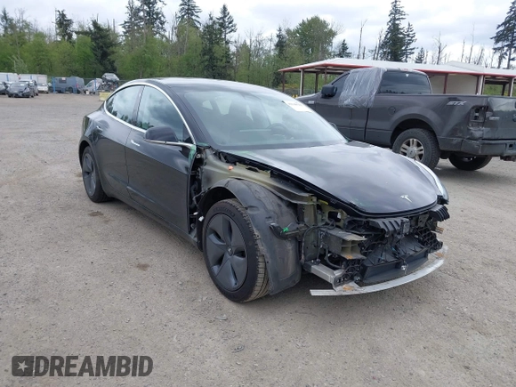 2019 Tesla Model 3 Mid Range with VIN 5YJ3E1EA6KF415656, listed as a IAAI auction lot 42140763 with 71,408 mi miles and . Bid and sale history available at carsss.com. Image 1.