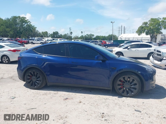 2023 Tesla Model Y Performance with VIN 7SAYGDEF9PF582908, listed as a IAAI auction lot 41930957 with 52,857 mi miles and . Bid and sale history available at DreamBid. Image 12.
