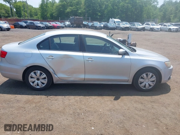 2012 Volkswagen Jetta SE z VIN 3VWDP7AJ5CM309927, wystawiony jako IAAI lot #42414951 z przebiegiem 128 109 mil mil oraz . Historia ofert i sprzedaży dostępna na DreamBid. Obrazek 13.
