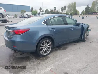 2014 Mazda 6 i Grand Touring with VIN JM1GJ1W64E1133729, listed as a IAAI auction lot 42050222 with 112,464 mi miles and . Bid and sale history available at DreamBid. Image 4.