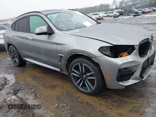 2021 BMW X4 M with VIN 5YMUJ0C01M9F26207, listed as a IAAI auction lot 41502307 with 31,995 mi miles. Bid and sale history available at carsss.com. Image 1.