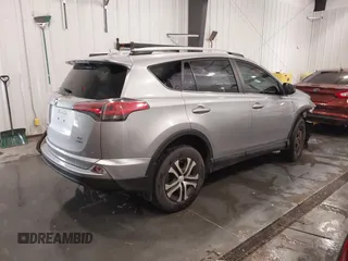 2016 Toyota RAV4 LE with VIN 2T3BFREV7GW450556, listed as a IAAI auction lot 41815720 with 106,734 mi miles. Bid and sale history available at carsss.com. Image 4.