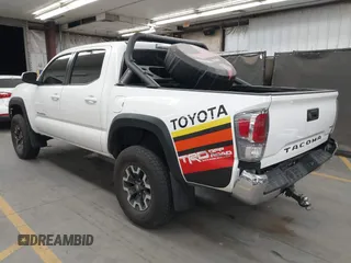 2022 Toyota Tacoma SR with VIN 3TMCZ5AN5NM480311, listed as a IAAI auction lot 42542600 with 43,297 mi miles and . Bid and sale history available at DreamBid. Image 3.