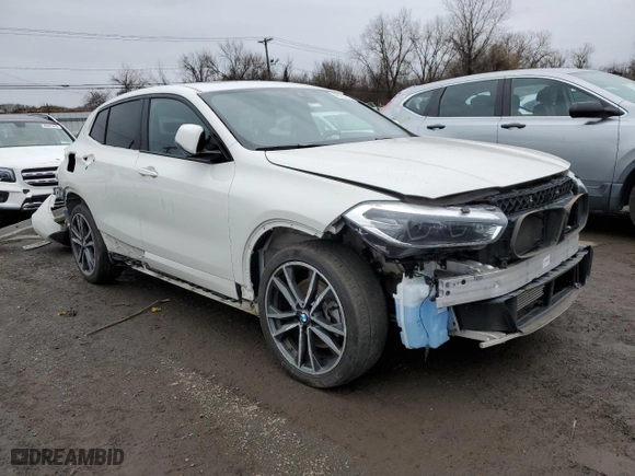 2022 BMW X2 xDrive28i with VIN WBXYJ1C04N5T43098, listed as a Copart auction lot 48757315 with 63,716 mi miles and Salvage Title. Bid and sale history available at carsss.com. Image 4.
