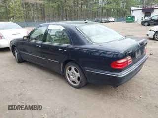 2002 Mercedes-Benz E-Class AWD with VIN WDBJF83J32X068355, listed as a IAAI auction lot 41872613 with 143,501 mi miles. Bid and sale history available at carsss.com. Image 3.