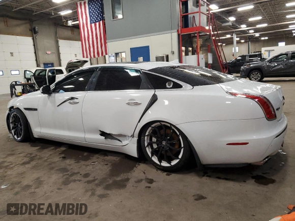 2014 Jaguar XJ Portfolio with VIN SAJWJ2GD2E8V69597, listed as a Copart auction lot 57798145 with 100,857 mi miles and Salvage title. Bid and sale history available at DreamBid. Image 2.