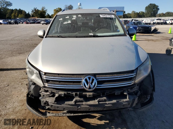 2014 Volkswagen Tiguan SE with VIN WVGAV3AX9EW611860, listed as a Copart auction lot 74431754 with 116,022 mi miles and Salvage title. Bid and sale history available at DreamBid. Image 5.