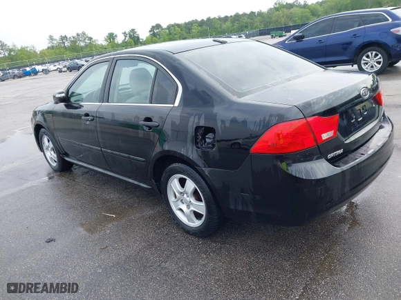2010 Kia Optima LX with VIN KNAGG4A85A5375227, listed as a IAAI auction lot 42019118 with 221,324 mi miles. Bid and sale history available at carsss.com. Image 3.