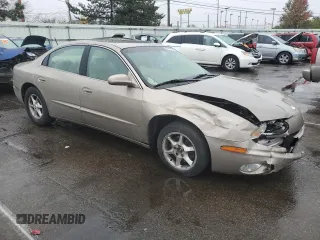 2001 Oldsmobile Aurora z VIN 1G3GR64H214292879, wystawiony jako Copart lot #79613954 z przebiegiem 88 709 mil mil oraz Szkody całkowita. Historia ofert i sprzedaży dostępna na DreamBid. Obrazek 4.
